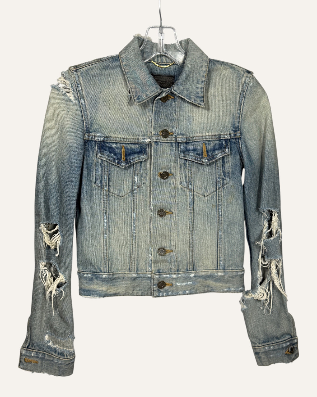 Saint Laurent light wash distressed denim fitted trucker jacket with ripped sleeves