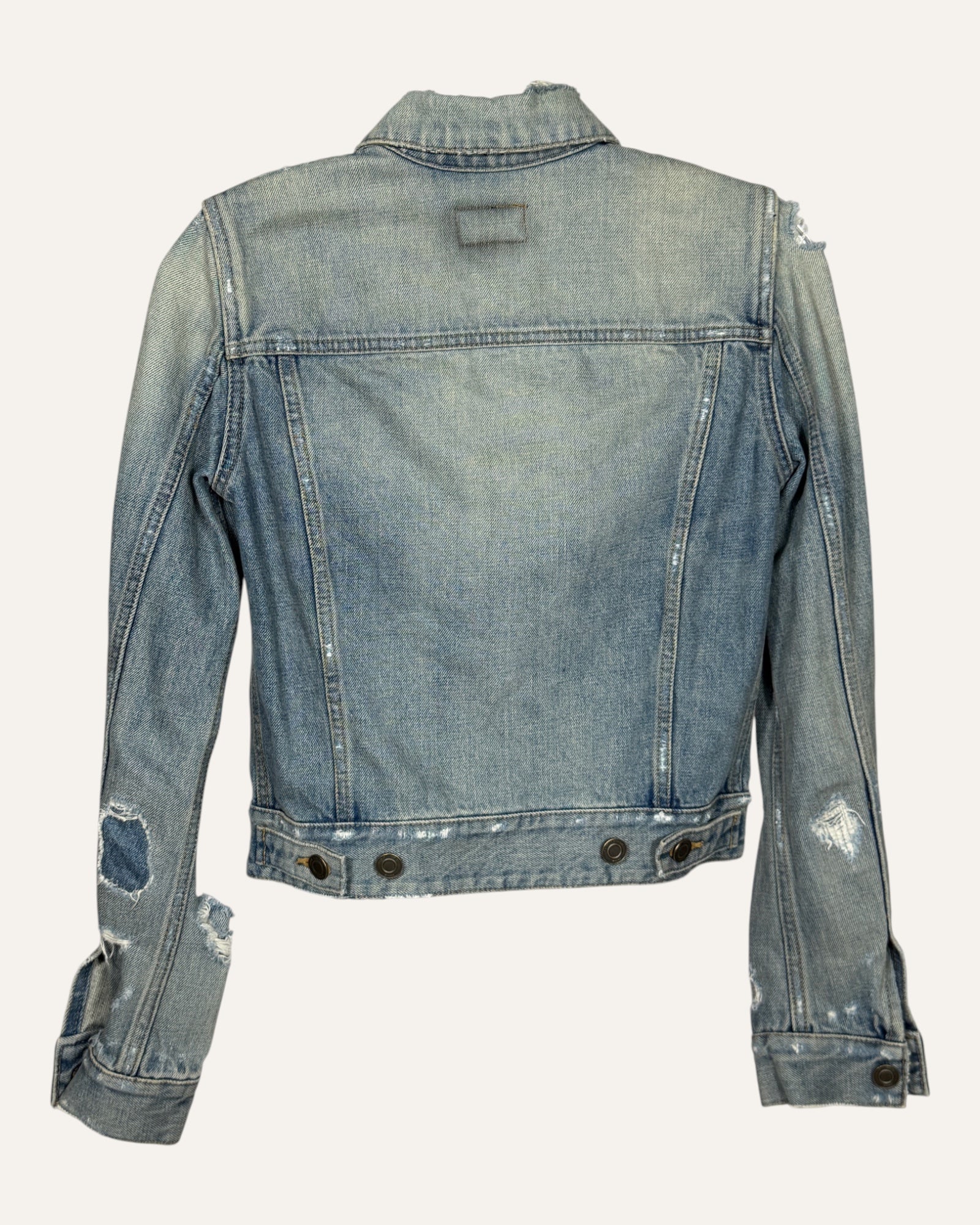 Saint Laurent light wash distressed denim fitted trucker jacket with ripped sleeves