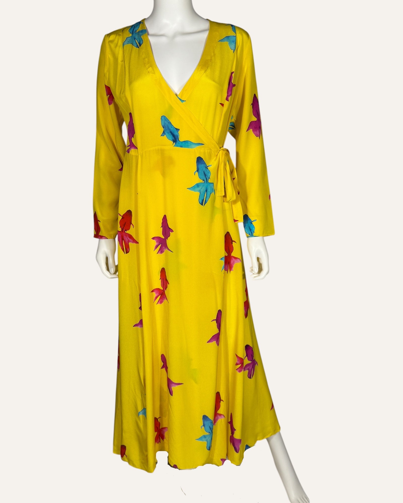 We Are Leone yellow silk wrap dress with blue, pink, and red fish print, long sleeves