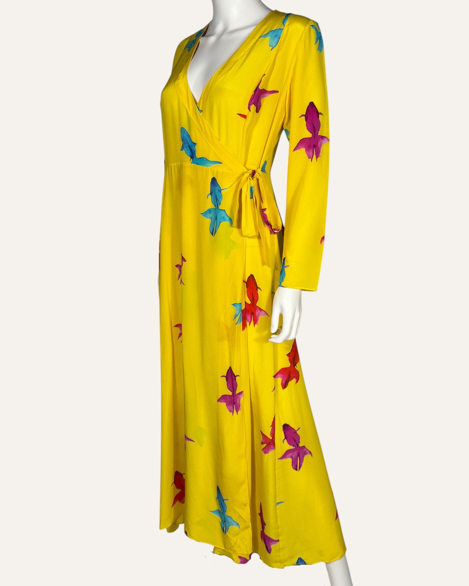 We Are Leone yellow silk wrap dress with blue, pink, and red fish print, long sleeves