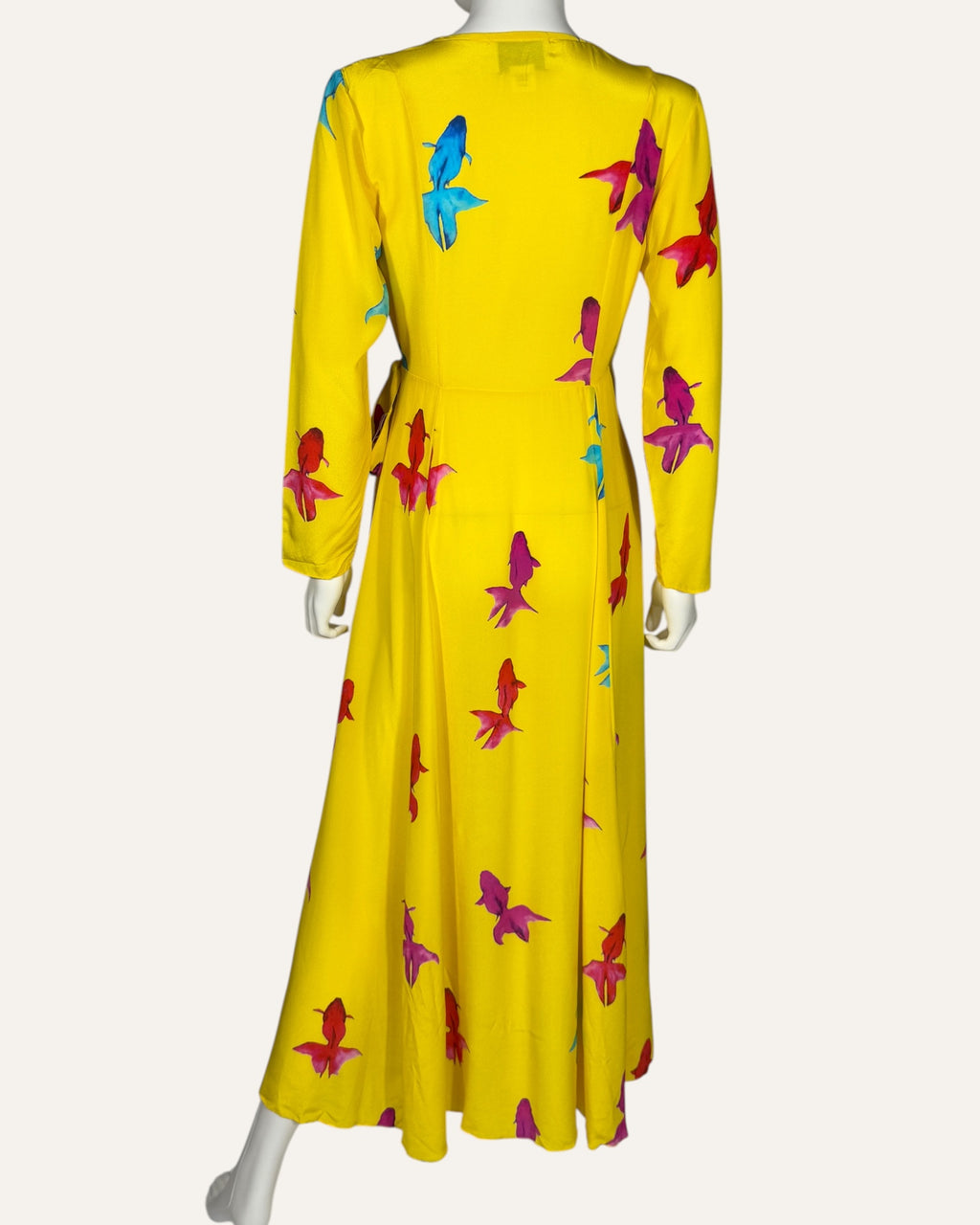 We Are Leone yellow silk wrap dress with blue, pink, and red fish print, long sleeves