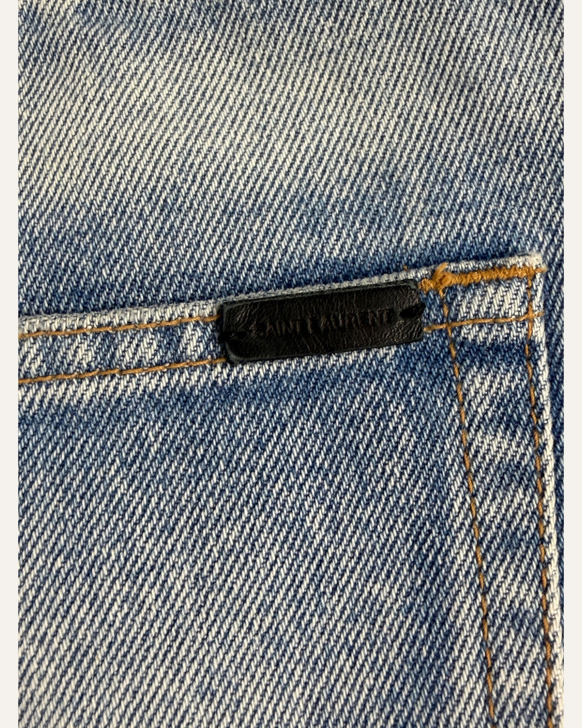 Saint Laurent mid-wash denim cutoff shorts with raw frayed hem