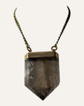 Oversized faceted smoky pendant necklace with gold-tone setting and curb chain