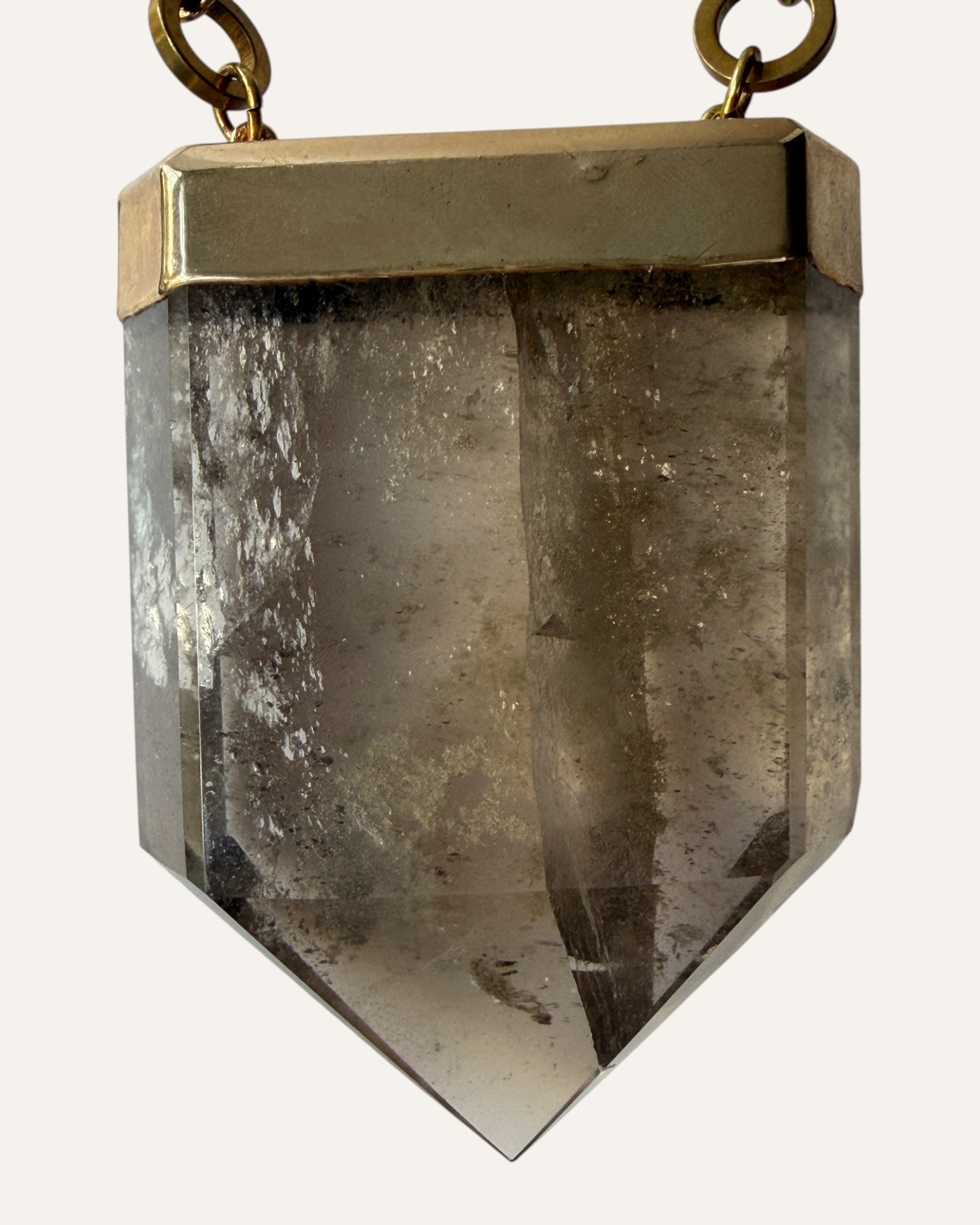 Oversized faceted smoky pendant necklace with gold-tone setting and curb chain