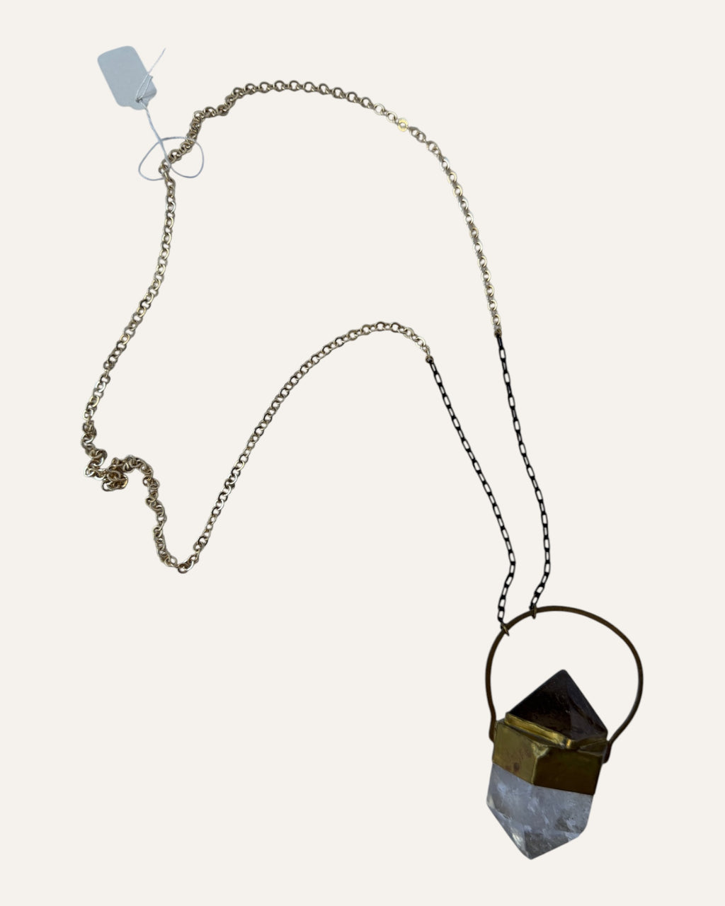 Sculptural crystal pendant necklace with gold-tone geometric setting and mixed metal chain