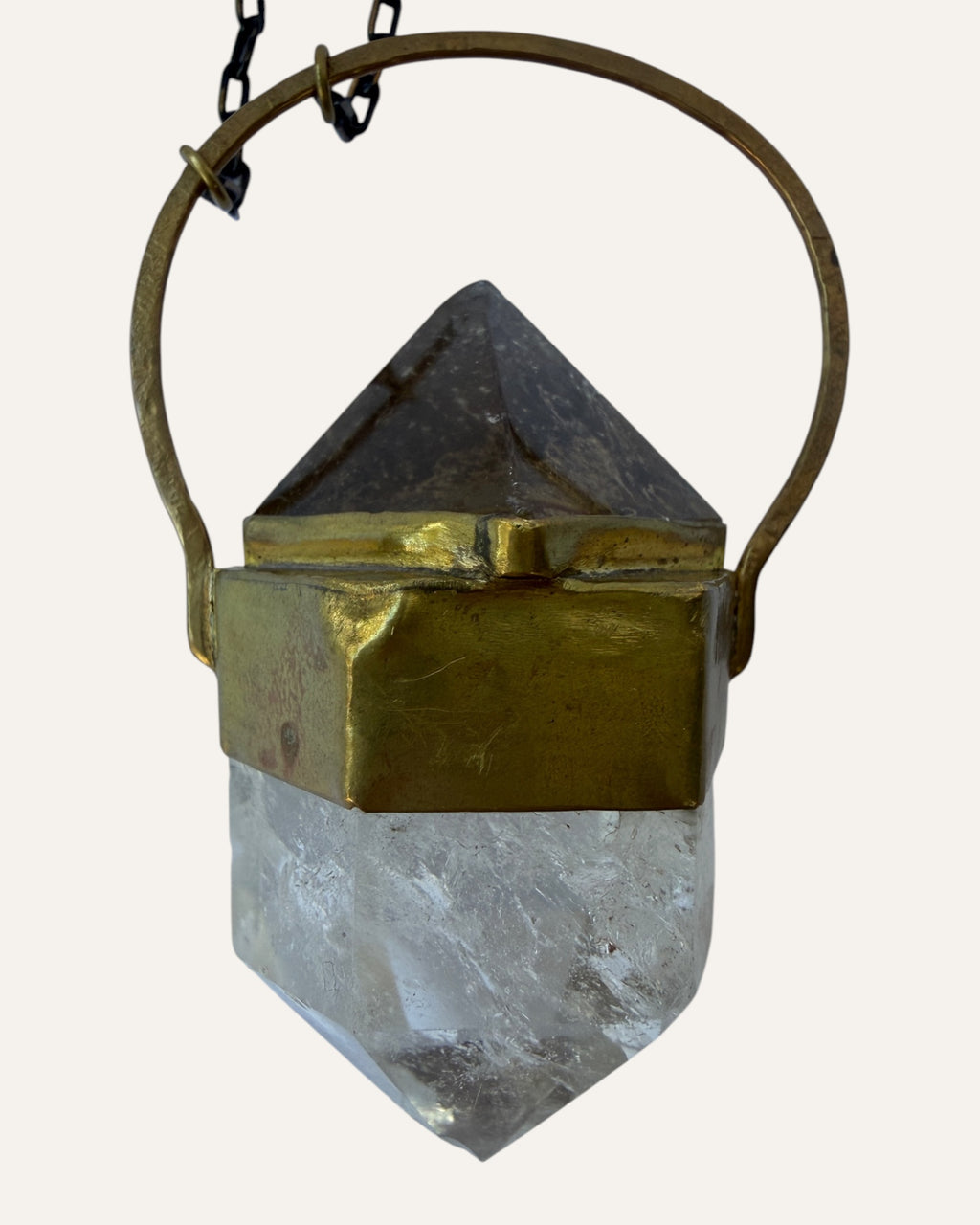 Sculptural crystal pendant necklace with gold-tone geometric setting and mixed metal chain