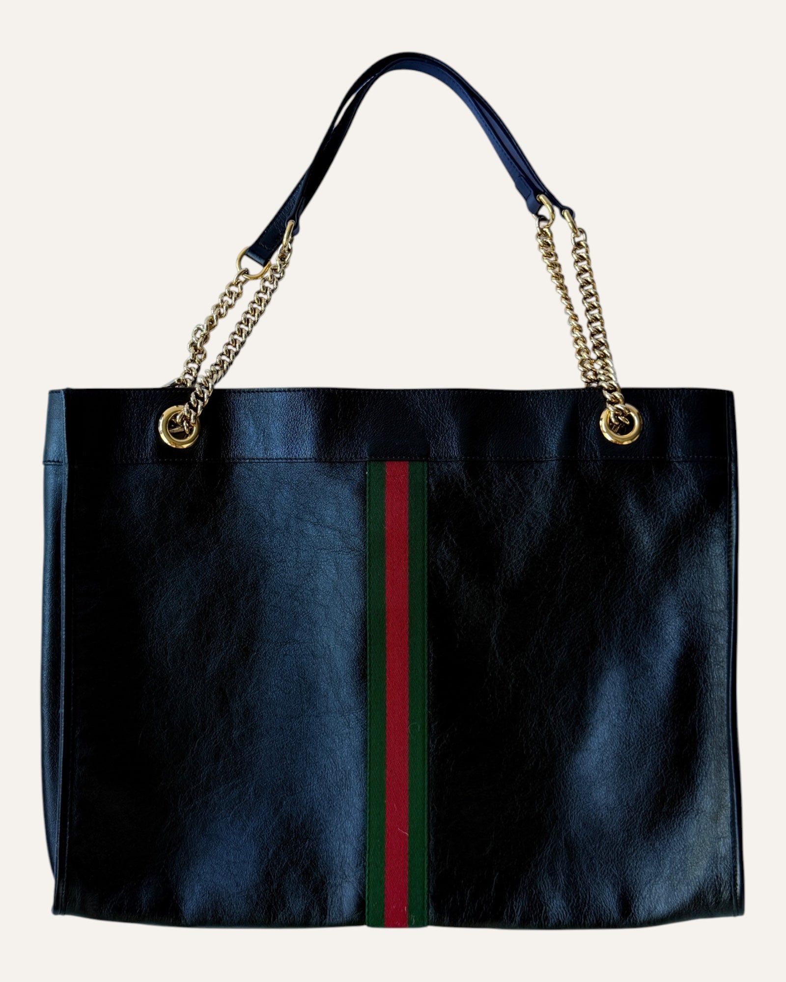 Gucci Rajah large black leather tote with gold chain straps, tiger head hardware, and matching zip pouch