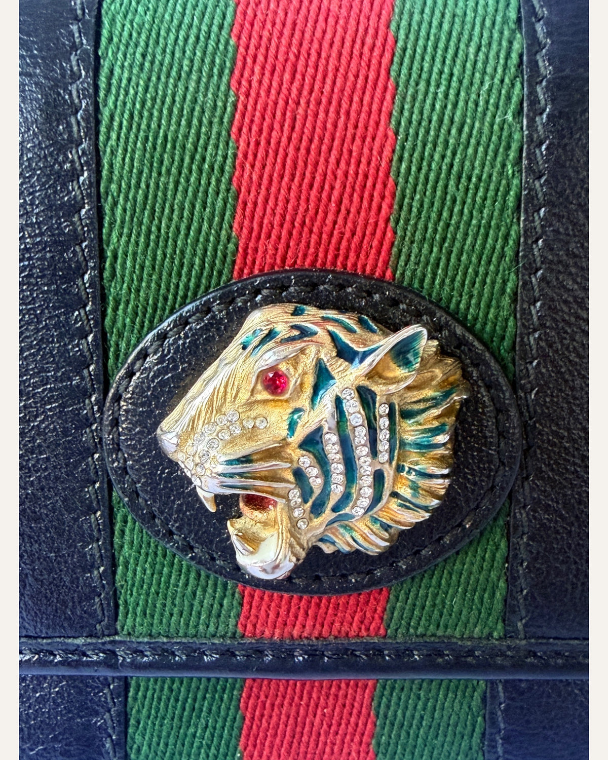Gucci Rajah continental wallet in black leather with tiger head hardware and green-red-green web stripe