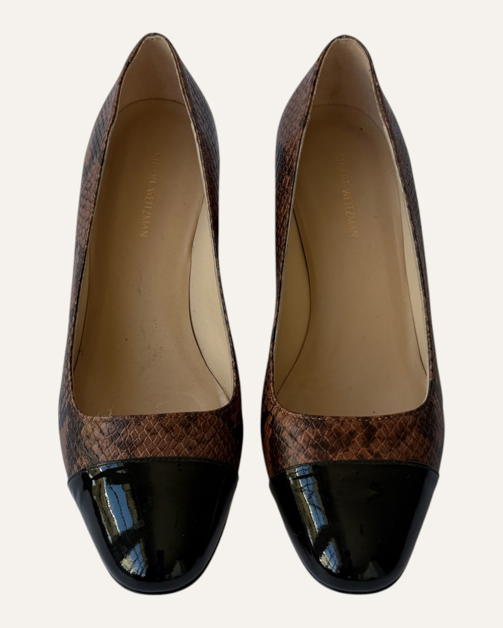 Stuart Weitzman brown snake-embossed leather pumps with black patent cap toes