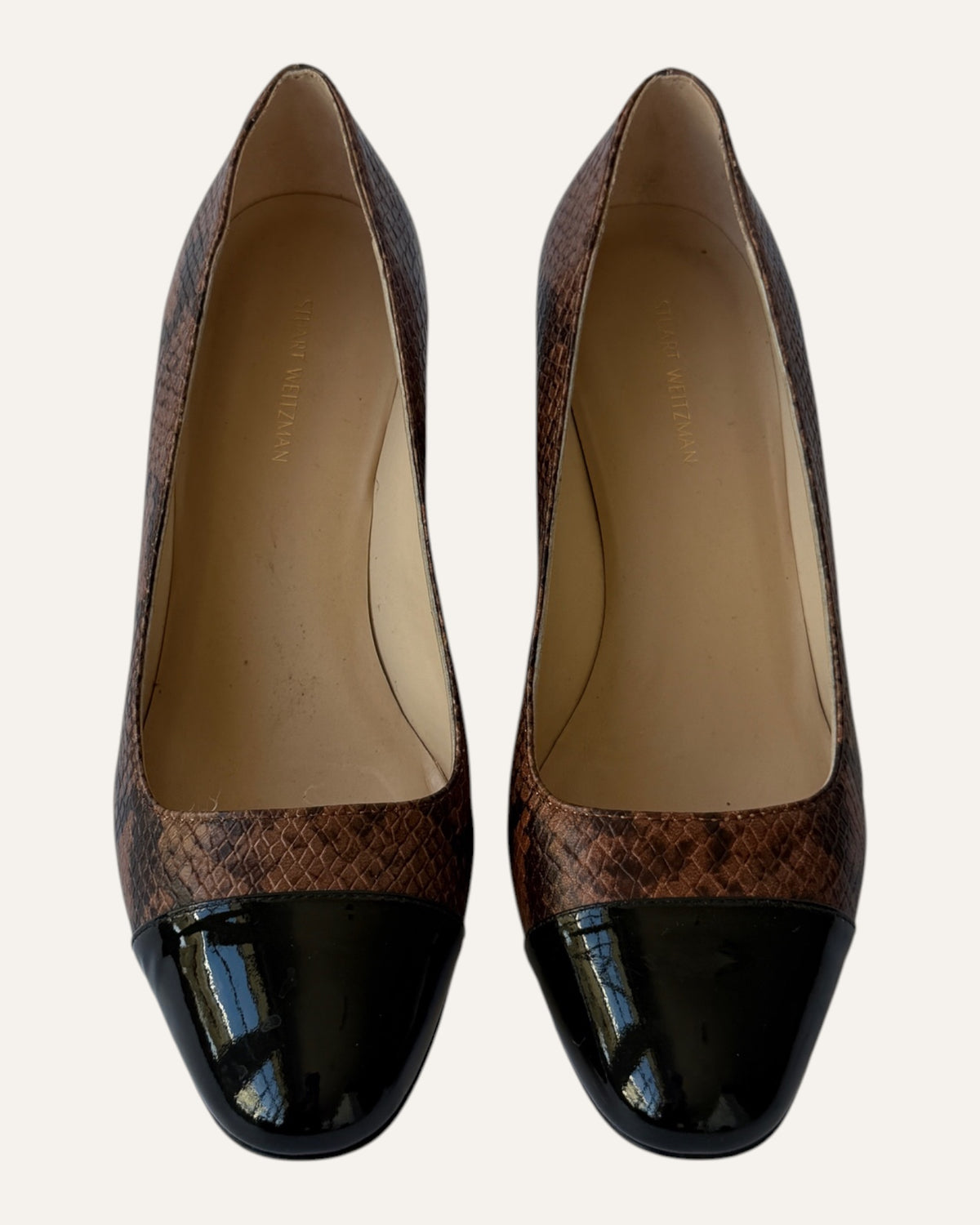 Stuart Weitzman brown snake-embossed leather pumps with black patent cap toes