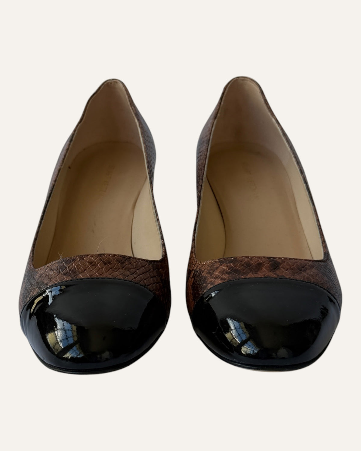 Stuart Weitzman brown snake-embossed leather pumps with black patent cap toes