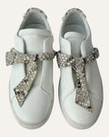 Alexandre Birman white leather slip-on sneakers with knotted jungle snake bow strap