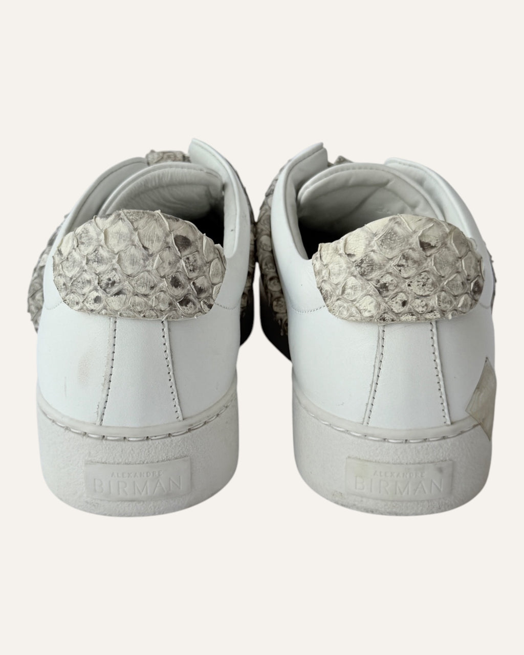 Alexandre Birman white leather slip-on sneakers with knotted jungle snake bow strap