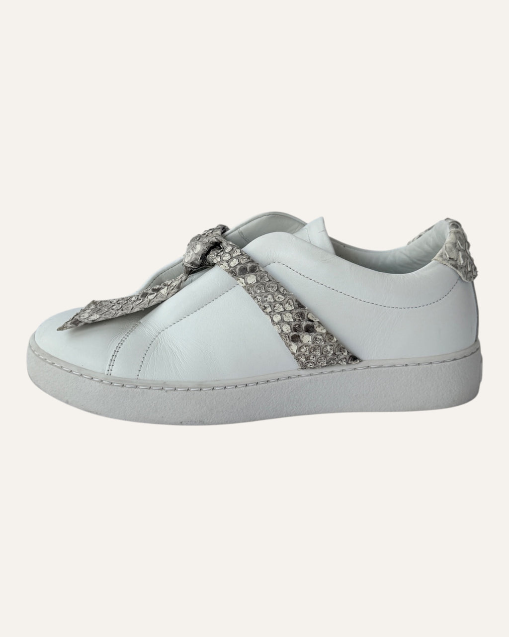 Alexandre Birman white leather slip-on sneakers with knotted jungle snake bow strap