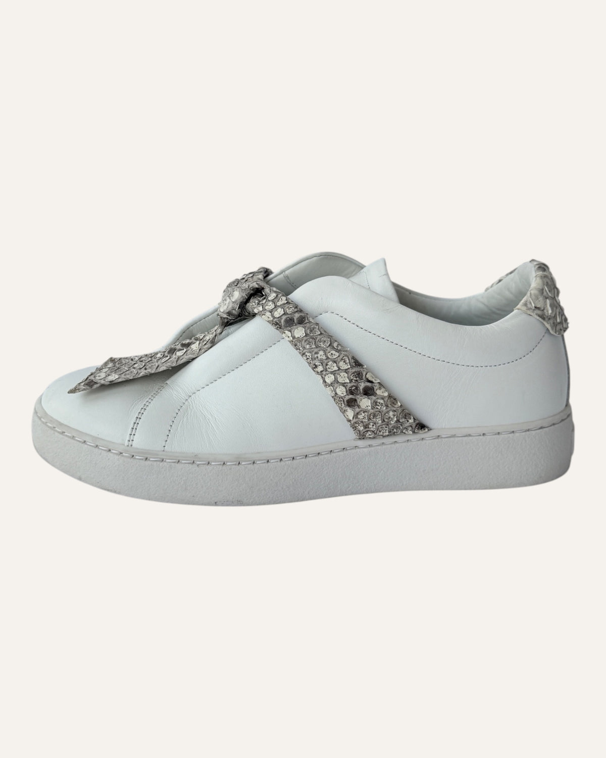 Alexandre Birman white leather slip-on sneakers with knotted jungle snake bow strap