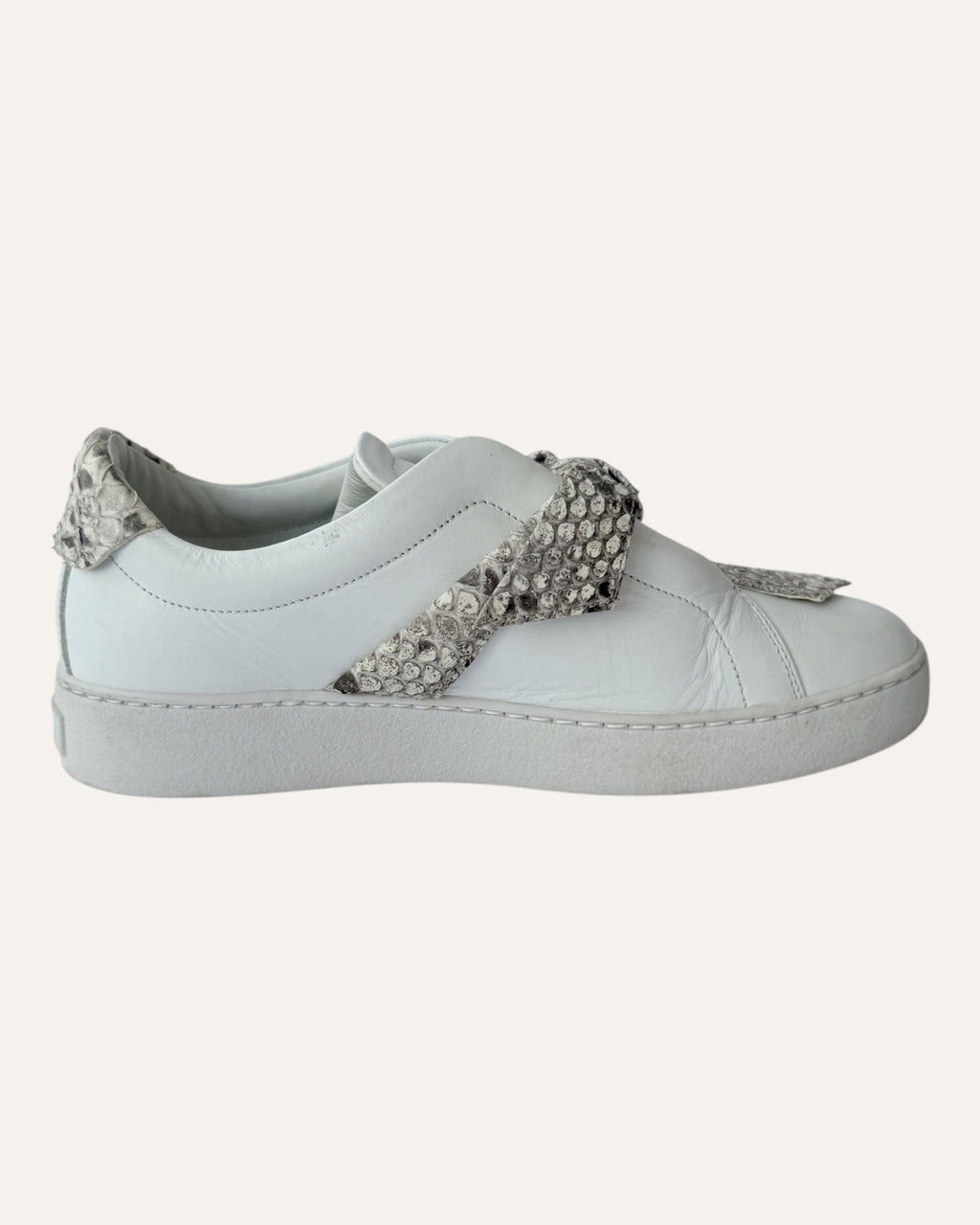 Alexandre Birman white leather slip-on sneakers with knotted jungle snake bow strap