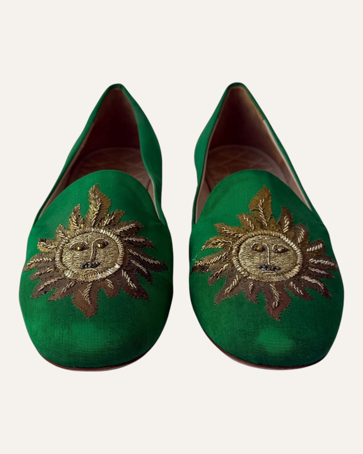 Aquazzura green loafers with metallic gold embroidered sun face and beaded details on the toes