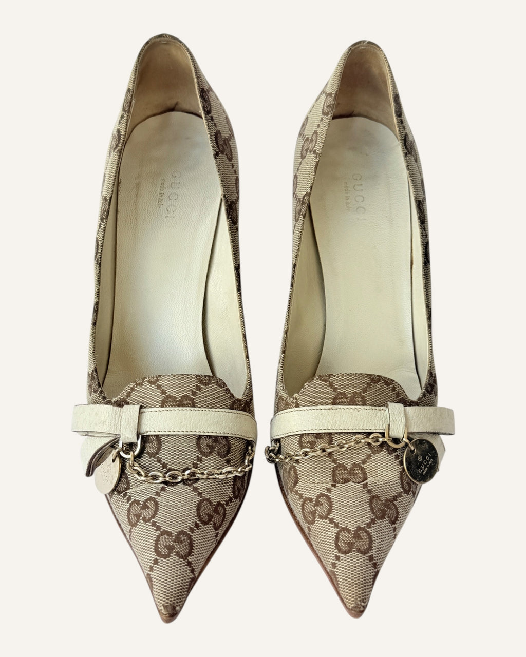 Vintage 2005 Gucci beige GG monogram canvas pointed-toe pumps with ivory leather strap, gold chain and logo charm, size 7.5