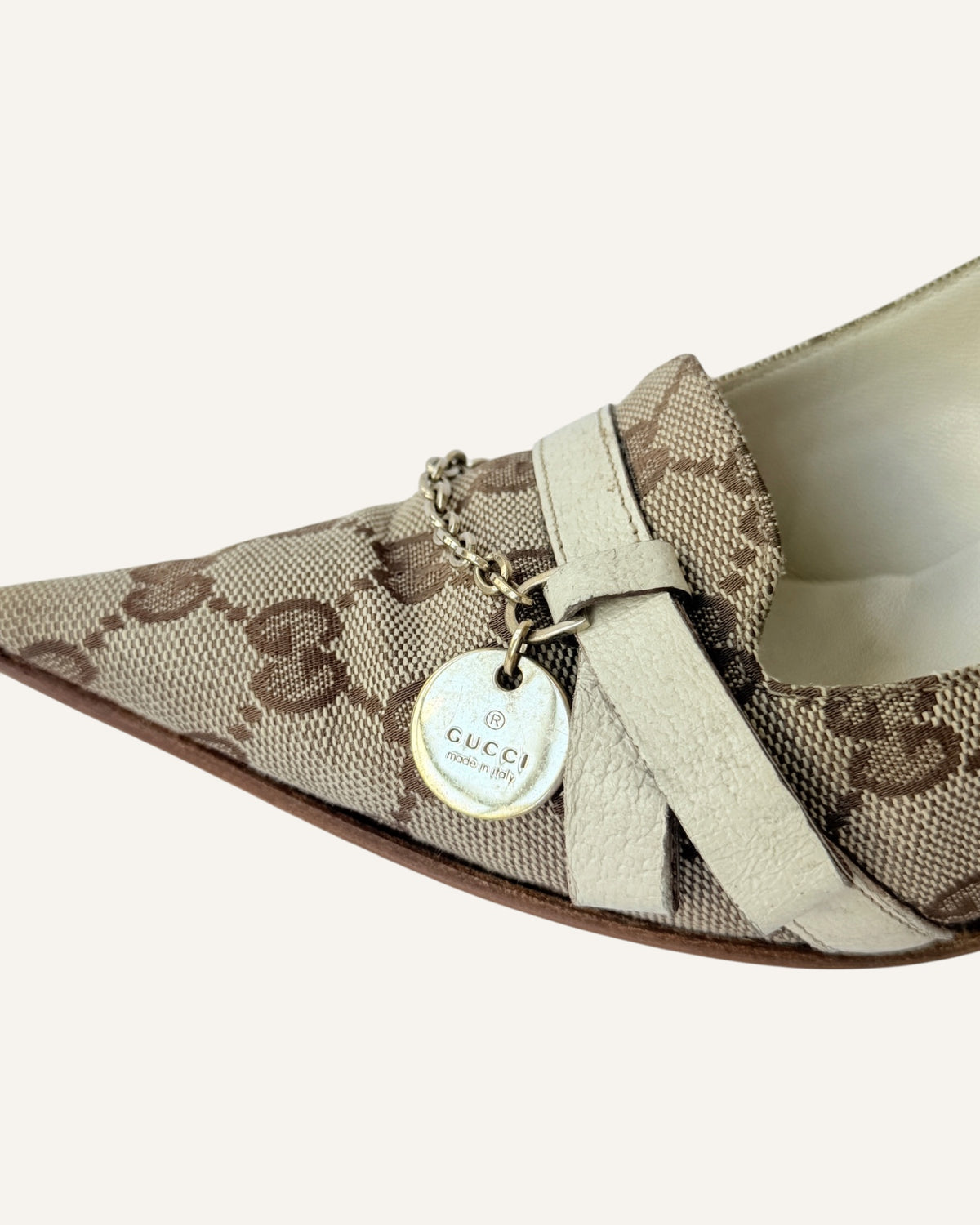 Vintage 2005 Gucci beige GG monogram canvas pointed-toe pumps with ivory leather strap, gold chain and logo charm, size 7.5