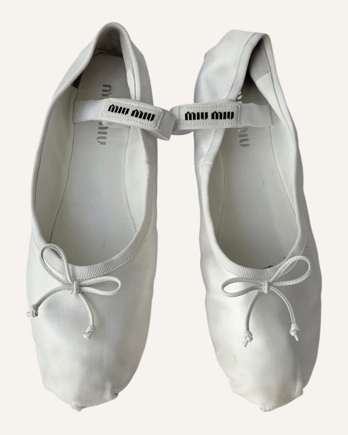 Miu Miu white satin Mary Jane ballet flats with leather bows and logo straps, size 40.5