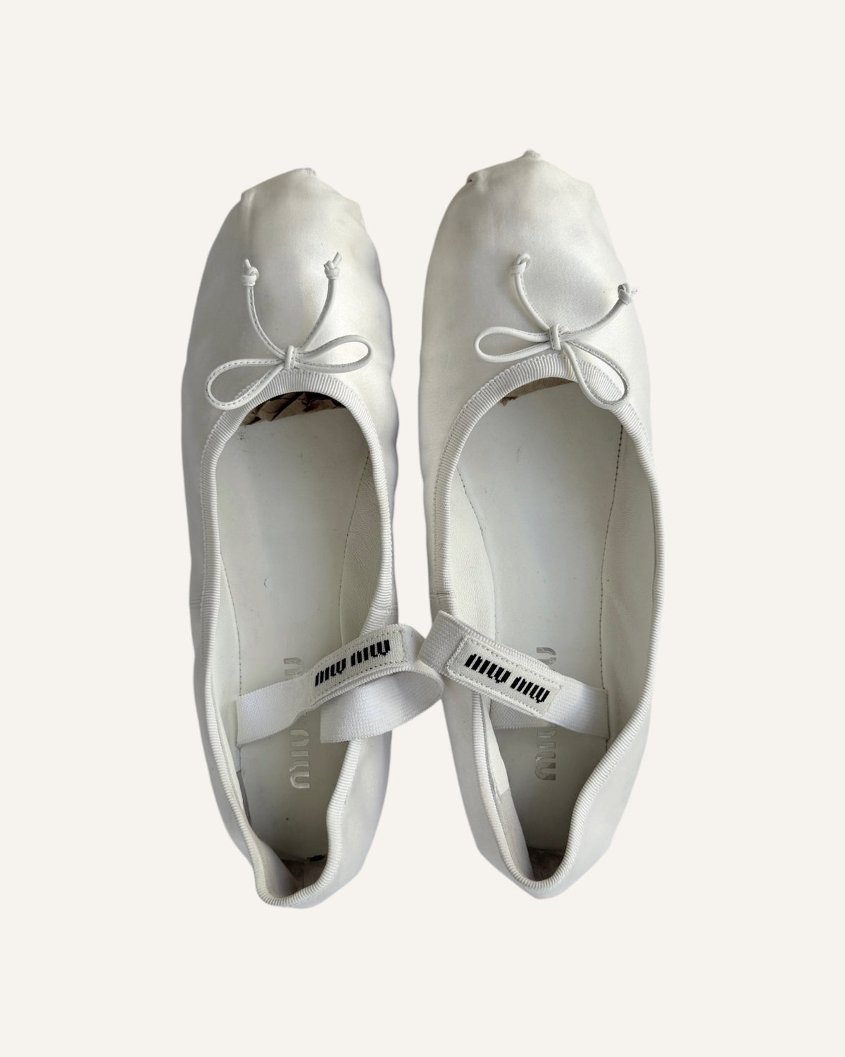 Miu Miu white satin Mary Jane ballet flats with leather bows and logo straps, size 40.5