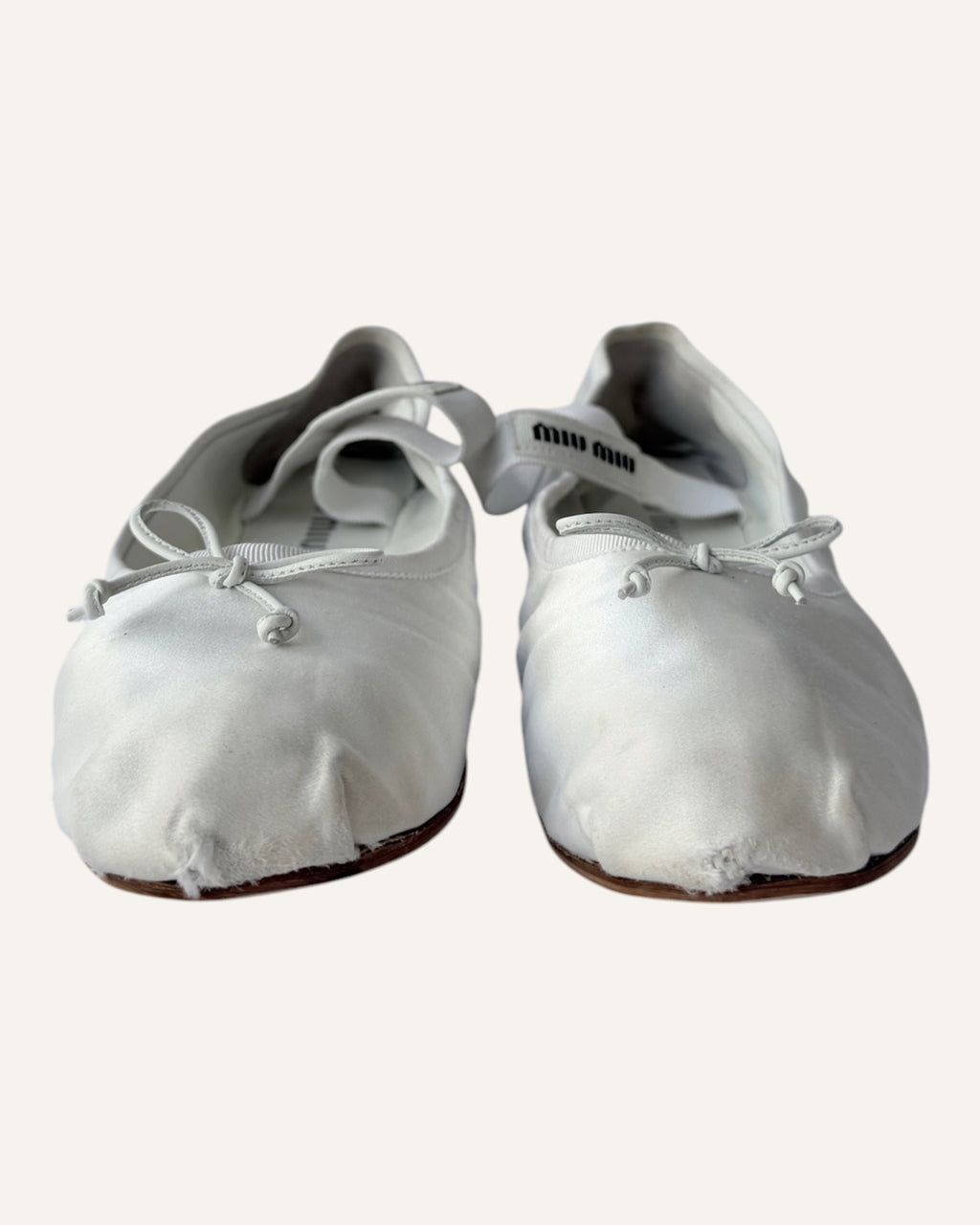 Miu Miu white satin Mary Jane ballet flats with leather bows and logo straps, size 40.5