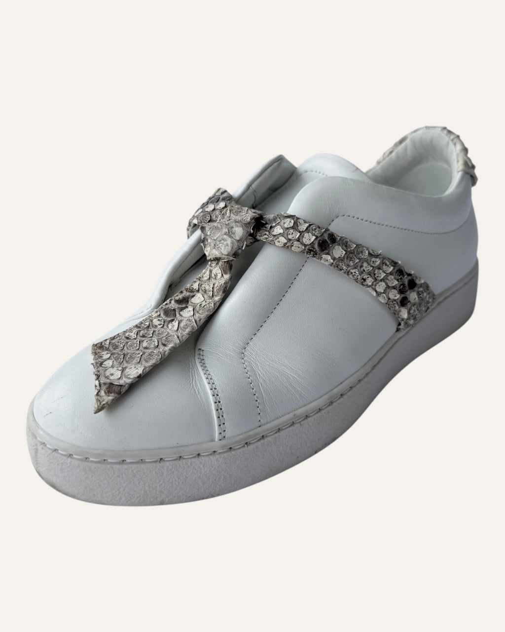 Alexandre Birman white leather slip-on sneakers with knotted jungle snake bow strap