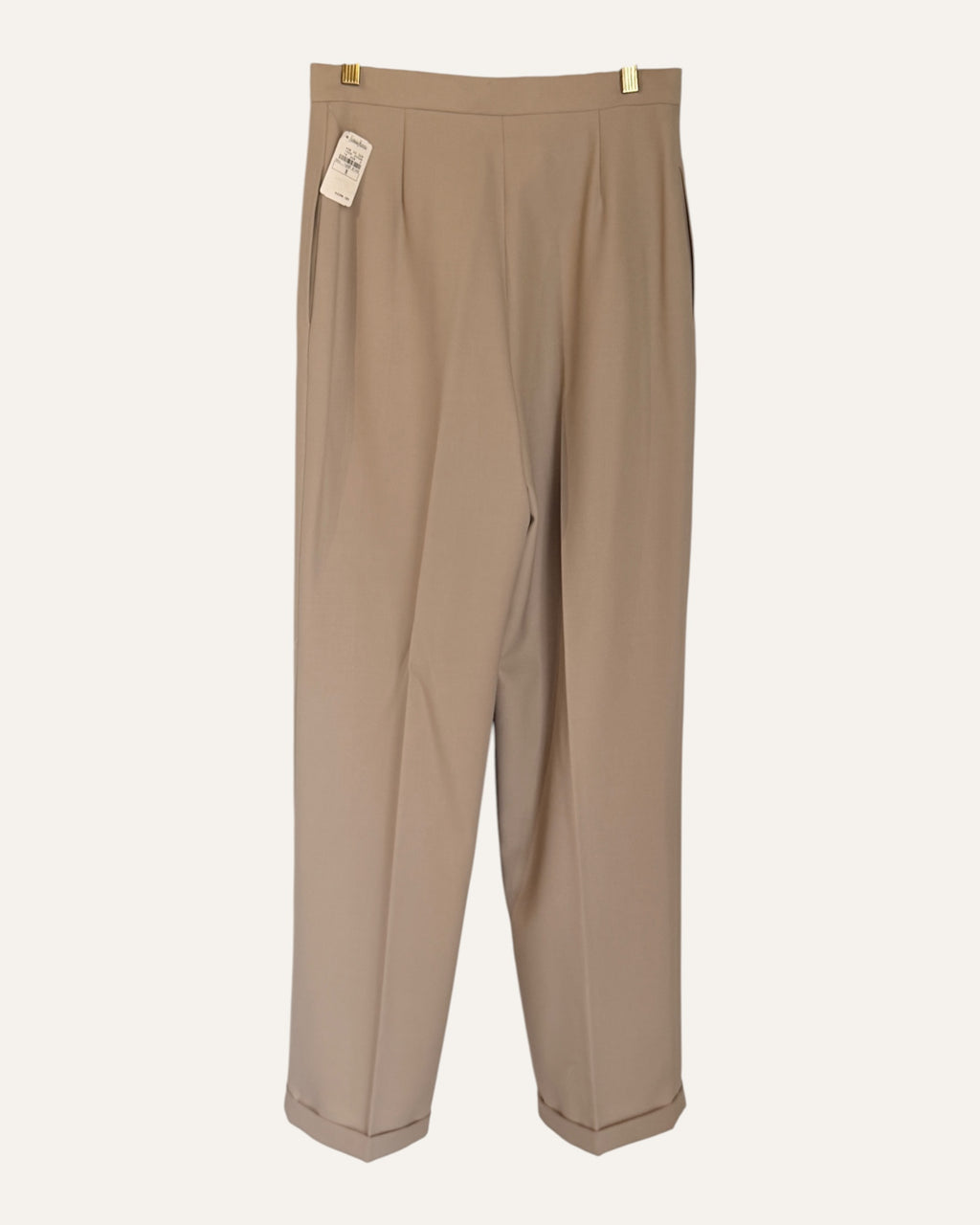 Oscar by Oscar de la Renta camel wool double-breasted blazer and pleated cuffed trousers with Neiman Marcus tags on cream background