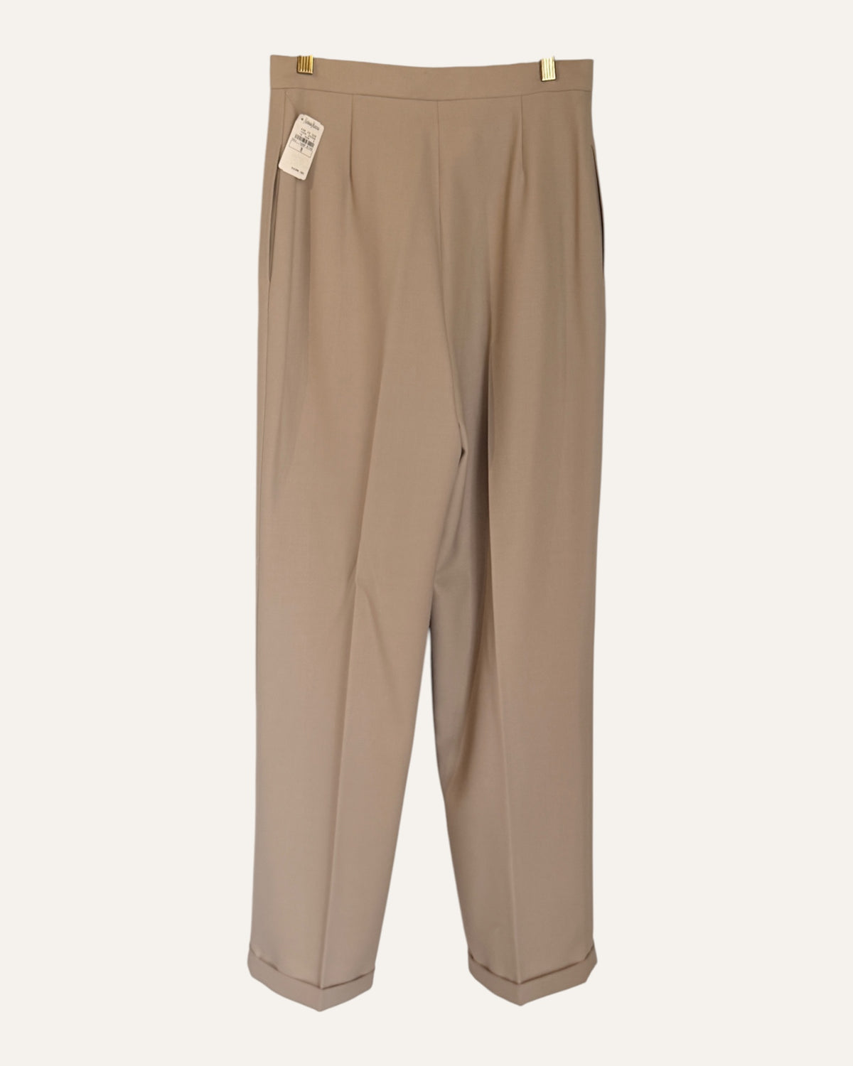 Oscar by Oscar de la Renta camel wool double-breasted blazer and pleated cuffed trousers with Neiman Marcus tags on cream background