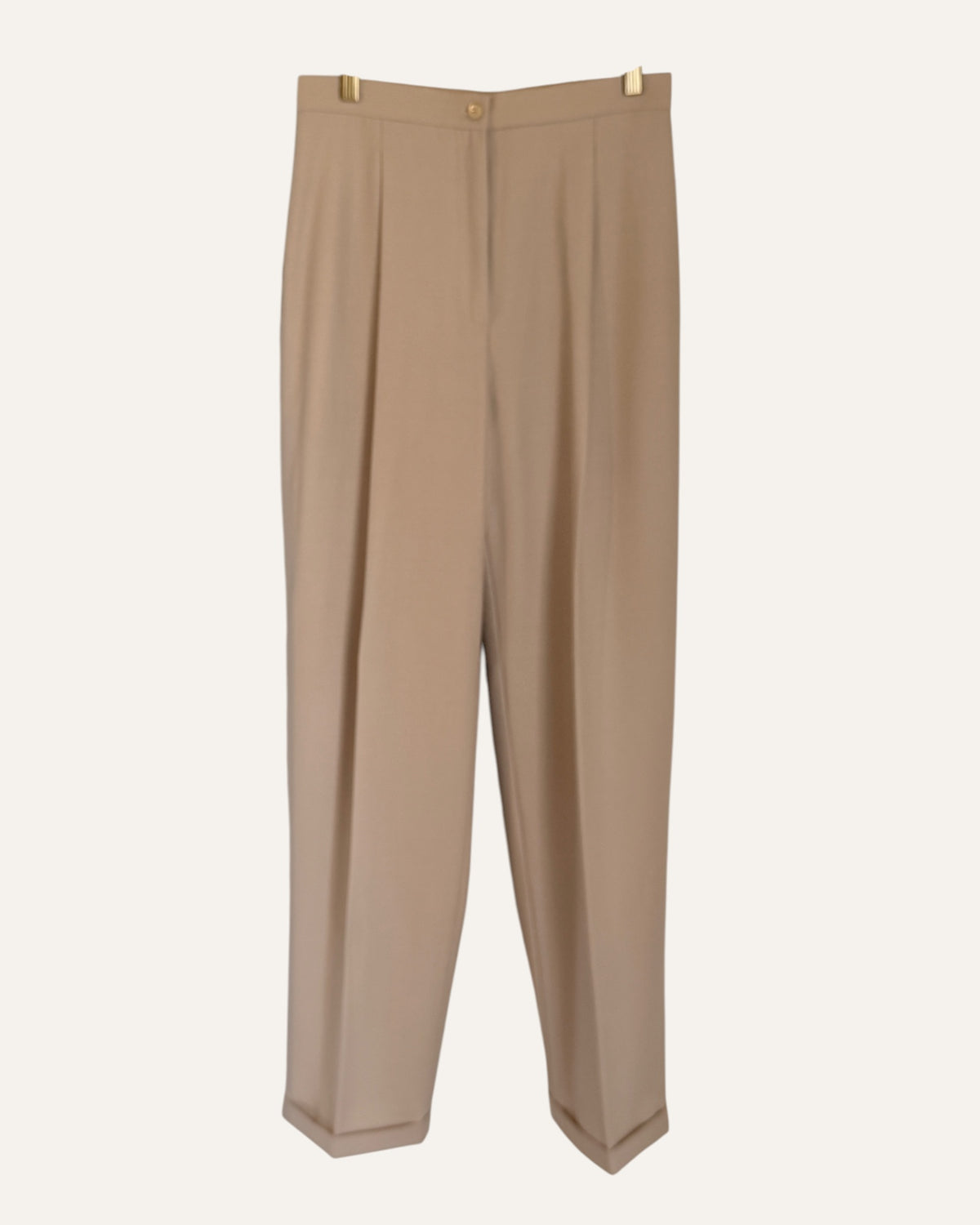 Oscar by Oscar de la Renta camel wool double-breasted blazer and pleated cuffed trousers with Neiman Marcus tags on cream background