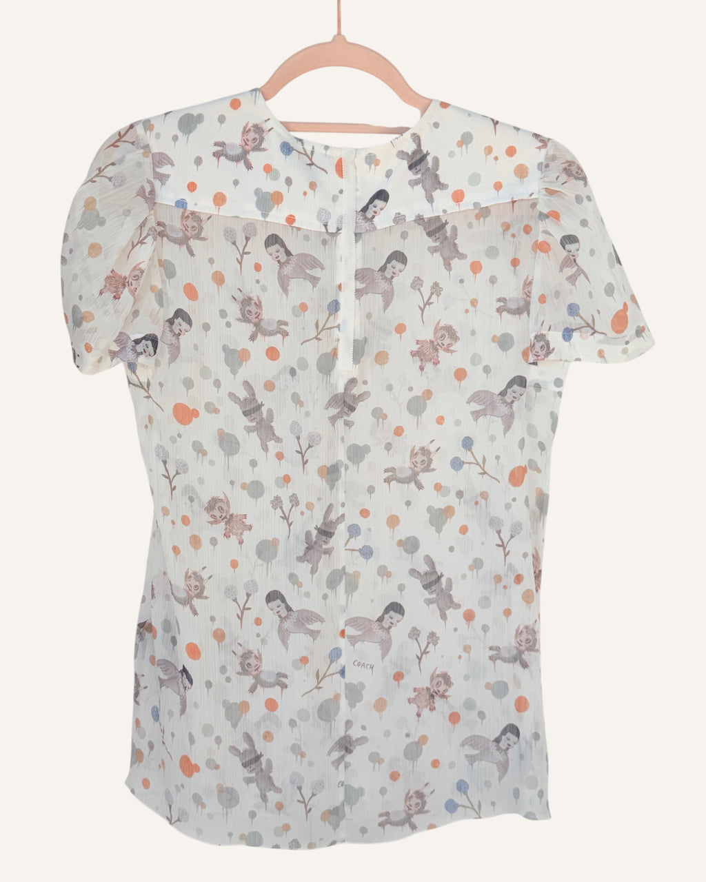 Coach x Gary Baseman ivory sheer blouse with allover whimsical character and floral print