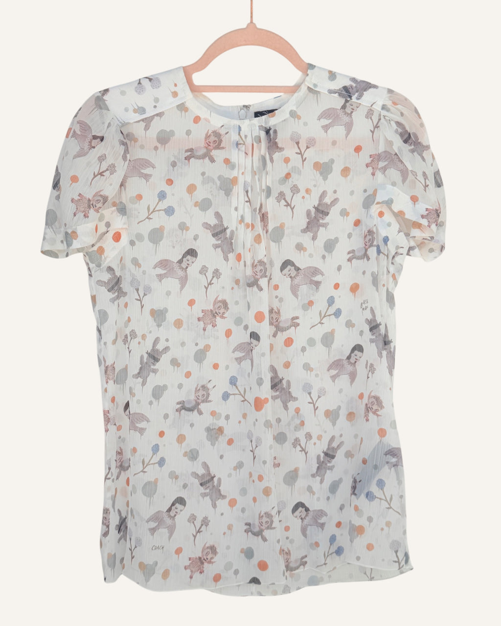 Coach x Gary Baseman ivory sheer blouse with allover whimsical character and floral print