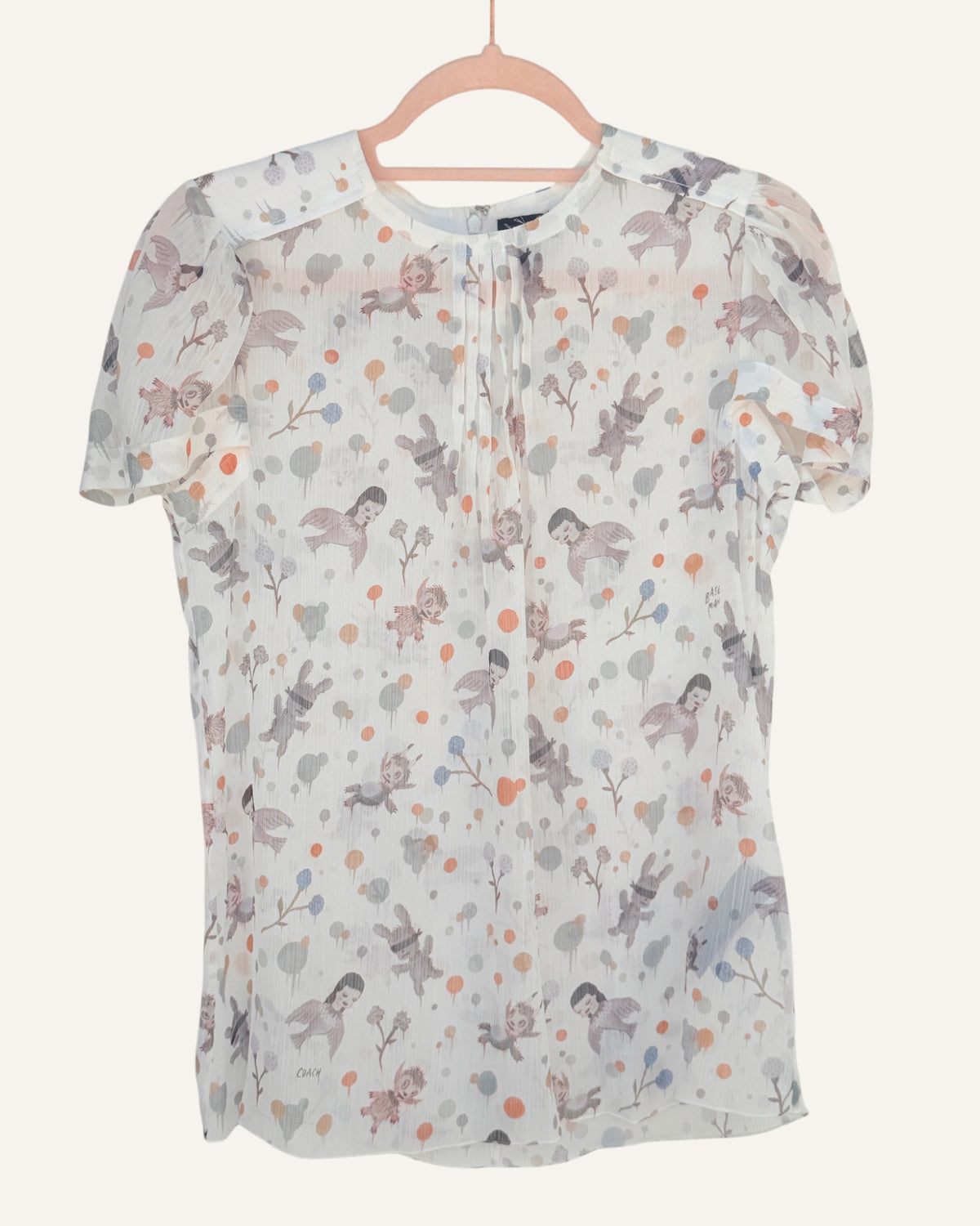 Coach x Gary Baseman ivory sheer blouse with allover whimsical character and floral print