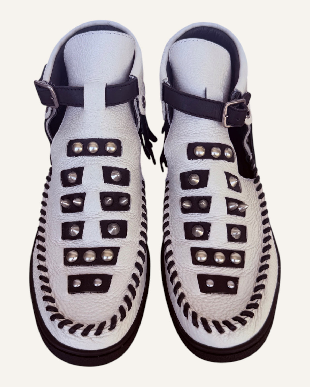 Coach 1941 Roccasin white leather studded fringe cutout booties with whipstitched moc toe and buckled ankle strap, pre-loved designer shoes