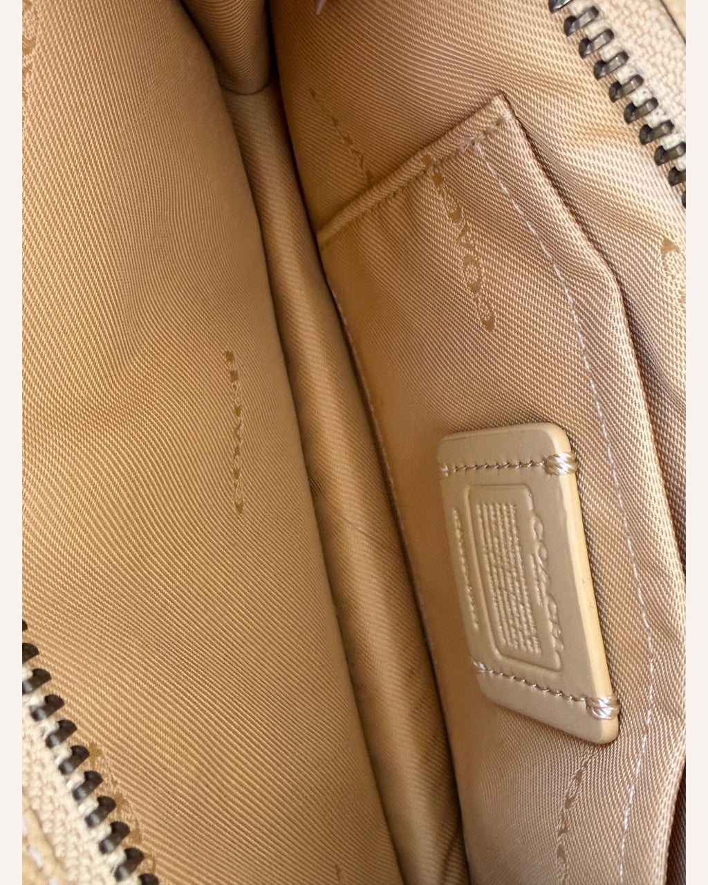 Coach mustard yellow pebbled leather wristlet wallet with snap-tab slip pocket and silver hardware