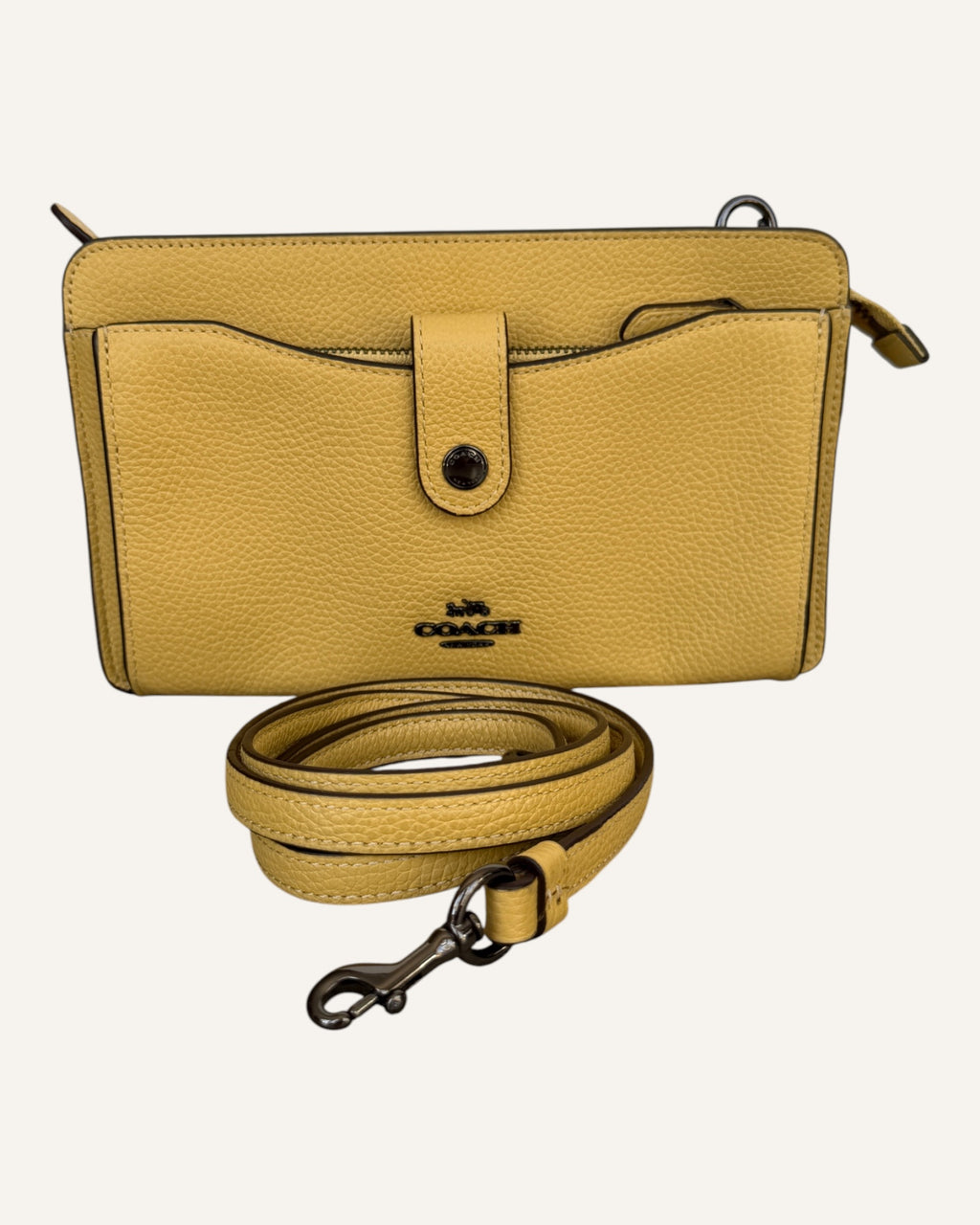 Coach mustard yellow pebbled leather wristlet wallet with snap-tab slip pocket and silver hardware