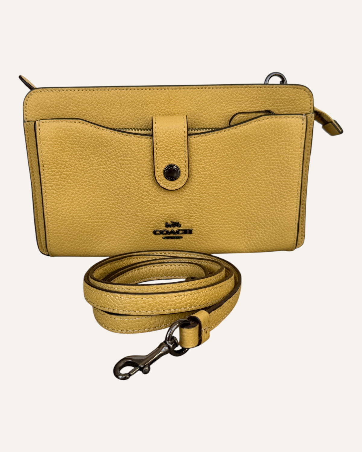 Coach mustard yellow pebbled leather wristlet wallet with snap-tab slip pocket and silver hardware