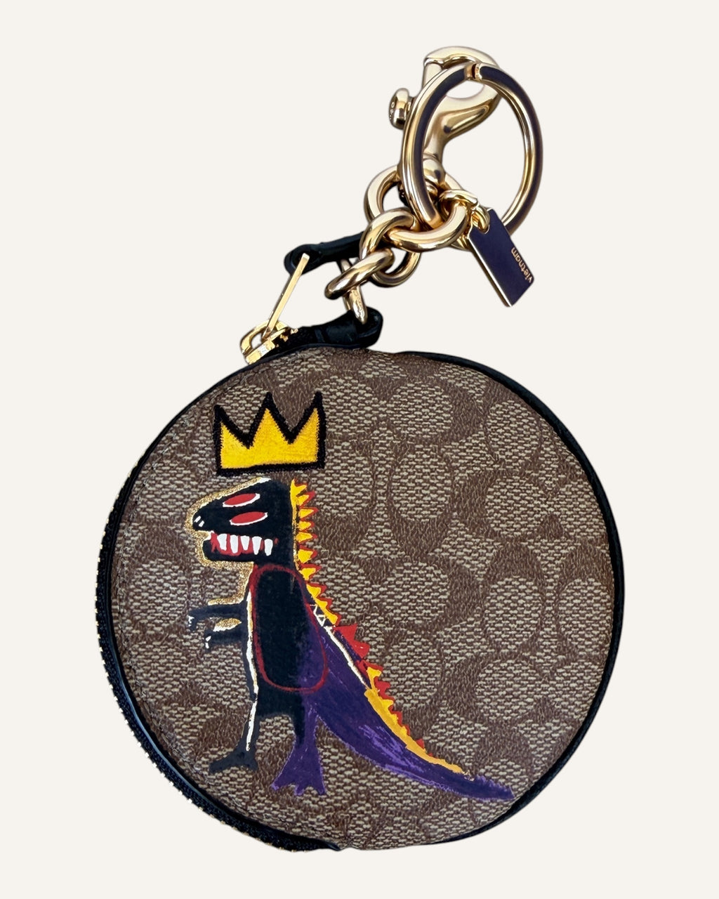 Coach x Jean-Michel Basquiat round coin pouch in brown Signature canvas with crowned Rexy artwork and gold key ring