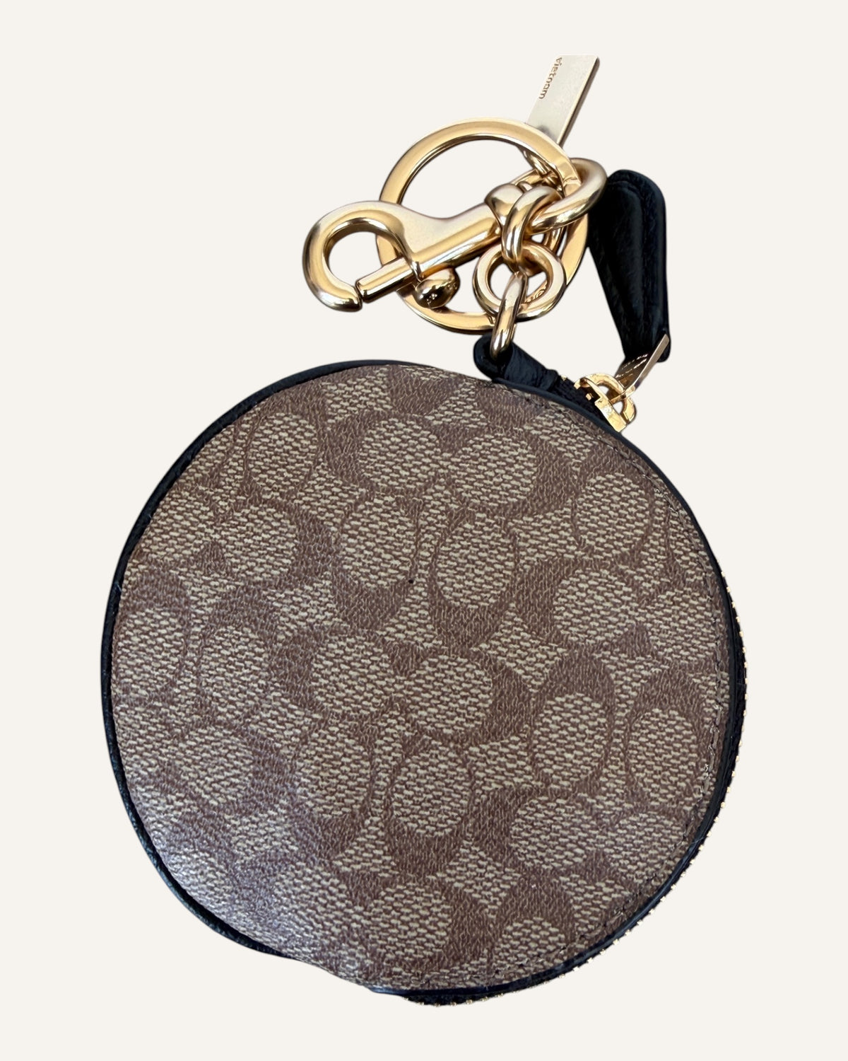 Coach x Jean-Michel Basquiat round coin pouch in brown Signature canvas with crowned Rexy artwork and gold key ring