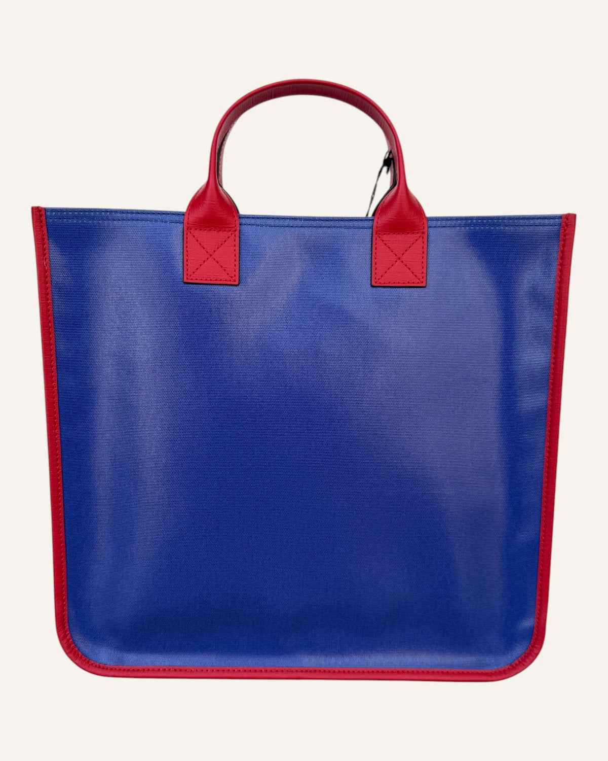 Gucci melting logo tote in royal blue coated canvas with red leather handles and yellow dripping logo print