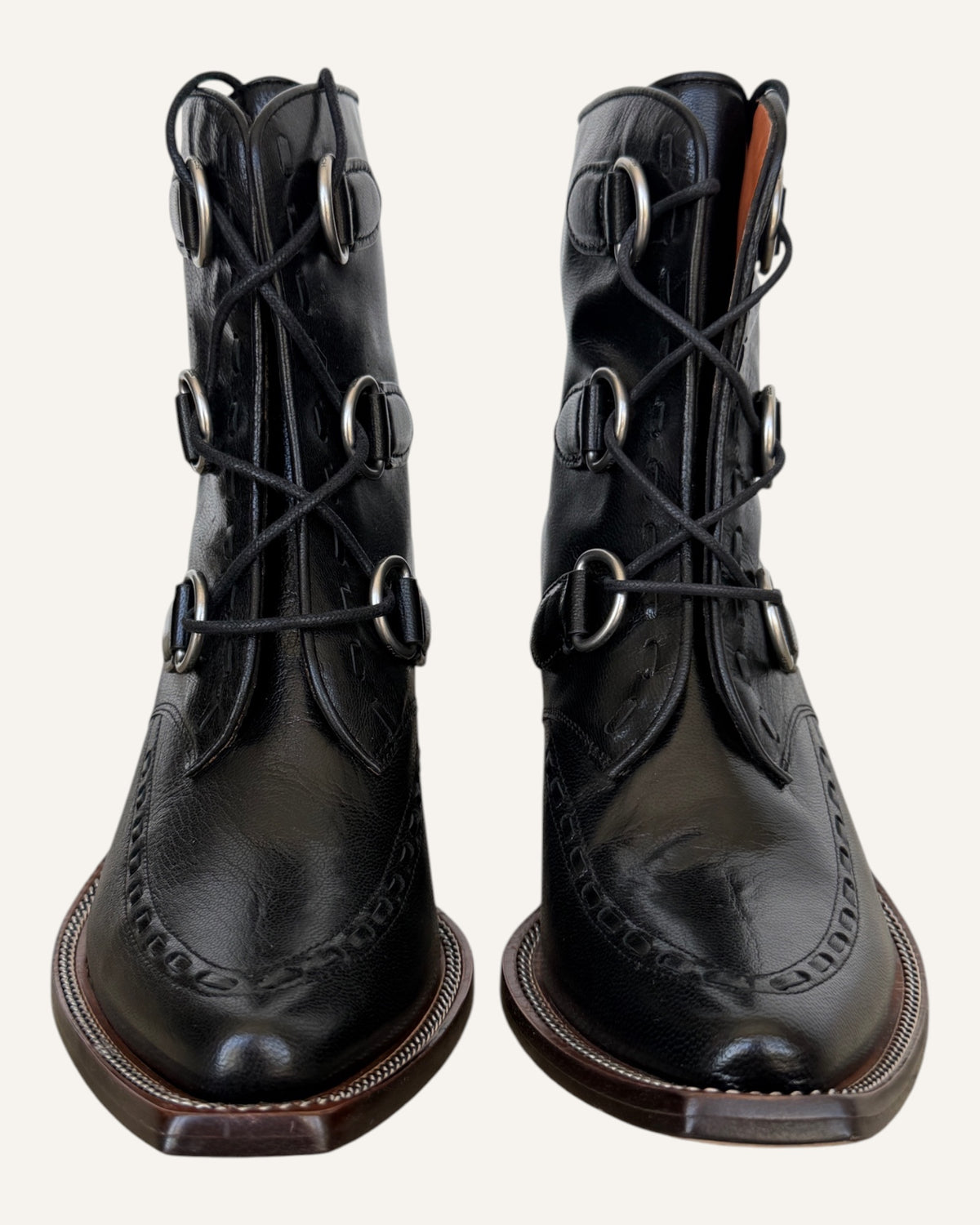 Coach black leather D-ring lace-up Western ankle boots with elongated toe and stacked heel, size 8.5