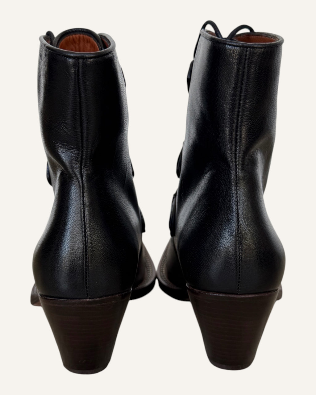Coach black leather D-ring lace-up Western ankle boots with elongated toe and stacked heel, size 8.5
